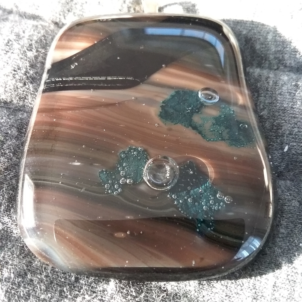 Custom glass pendant in browns and blues